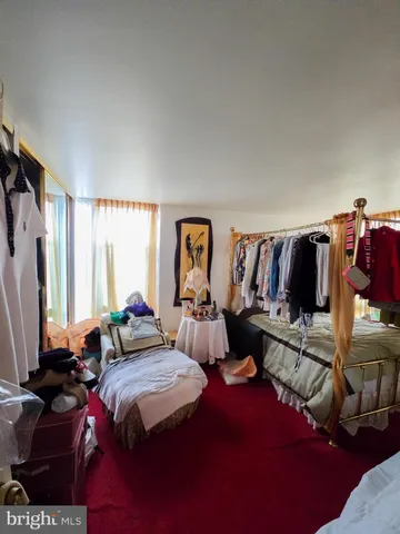 a living room with lots of furniture and a flat screen tv