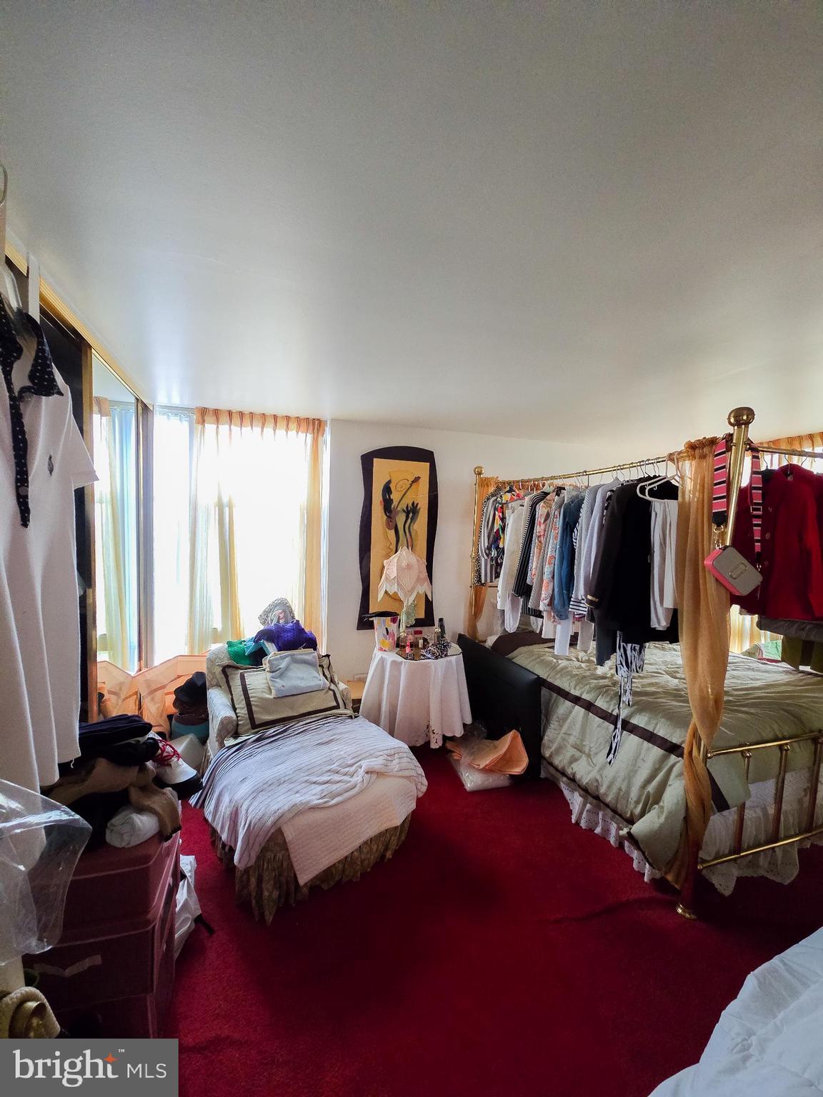 3600 Conshohocken Avenue, Unit 1804 Philadelphia, PA 19131 - Photo 8 of 10 a living room with lots of furniture and a flat screen tv