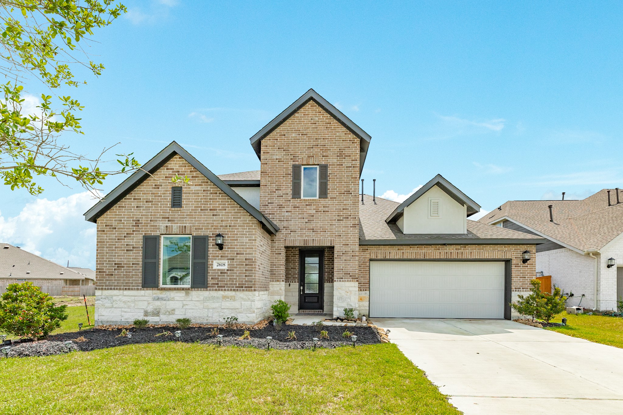 2618 Jasper Oaks Drive Rosharon, TX 77583 - Photo 1 of 43 a front view of a house with yard and glass windows
