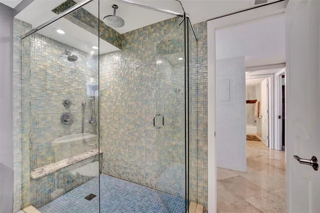 a bathroom with a shower and a sink