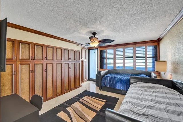 a view of a hallway with paintings on the wall