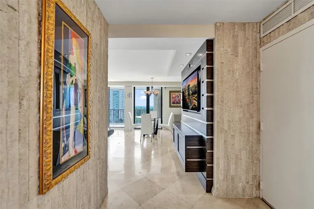 a living room with furniture and a work place area