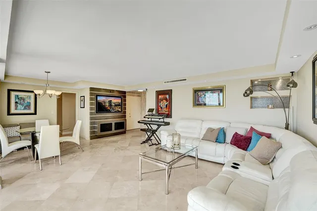 a view of living room kitchen with furniture and wooden floor
