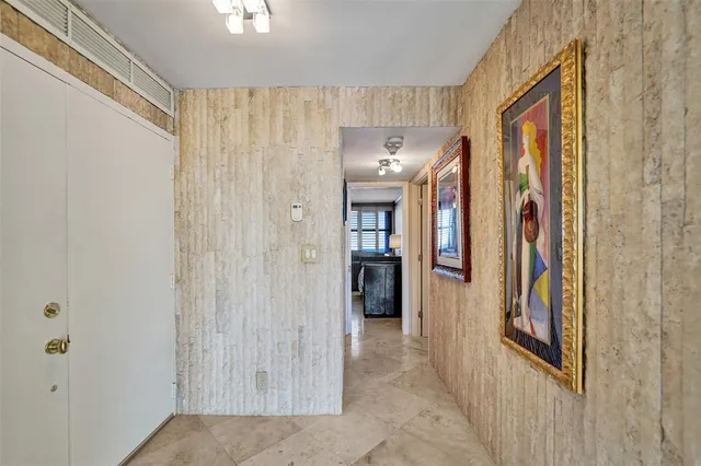 a kitchen with stainless steel appliances granite countertop a sink and a microwave