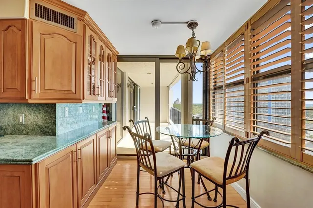 a view of a kitchen with a sink and stove