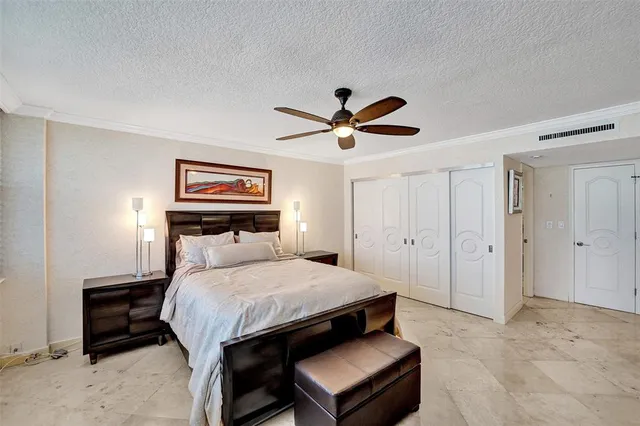 a bathroom with a granite countertop sink and a large mirror