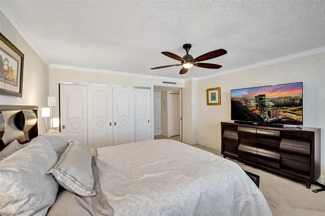 a bathroom with a granite countertop sink a mirror and shower