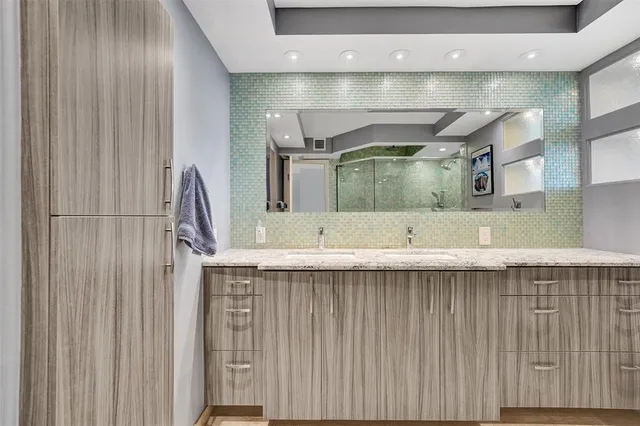 a spacious bedroom with two beds and a large window