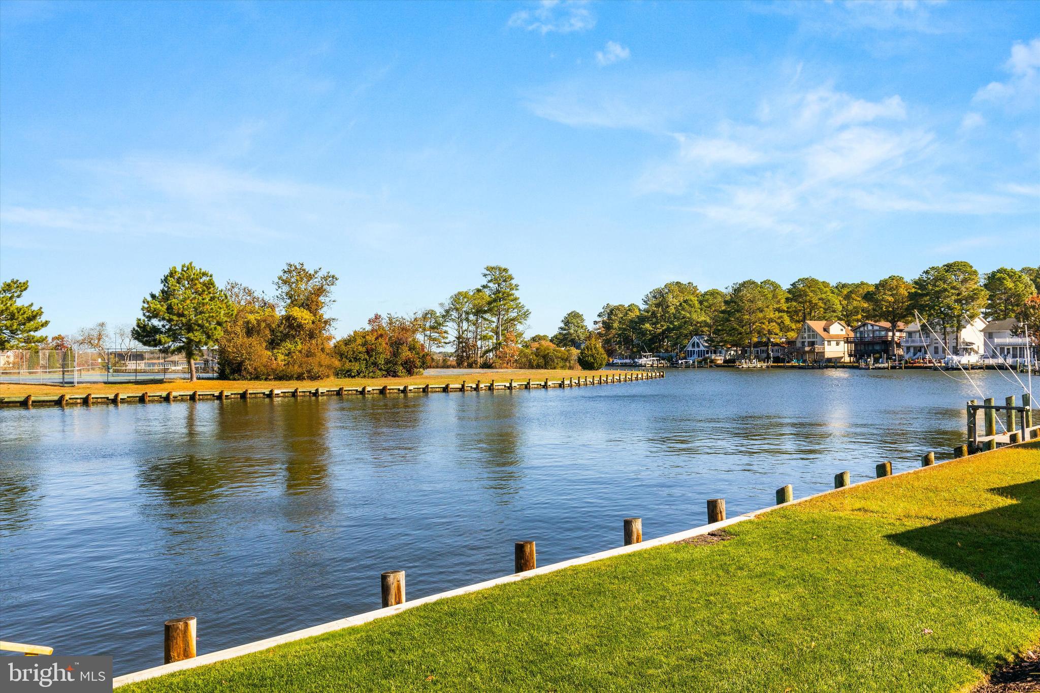 61 Grand Port Road Ocean Pines, MD 21811 - Photo 2 of 68 a view of a lake with houses
