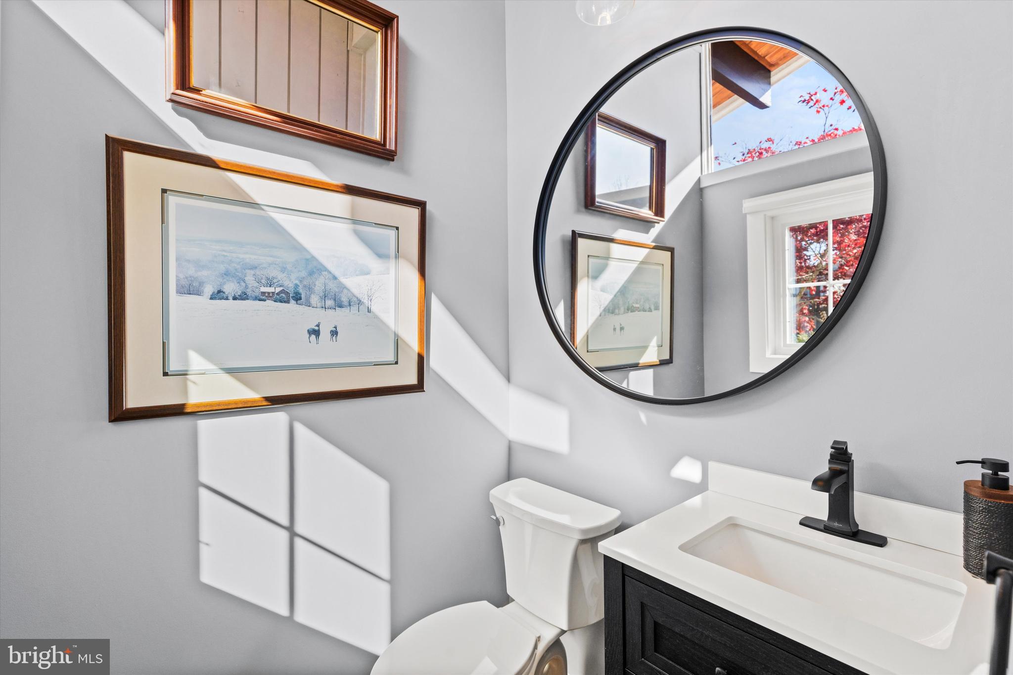 61 Grand Port Road Ocean Pines, MD 21811 - Photo 34 of 68 a bathroom with a toilet a sink and a mirror