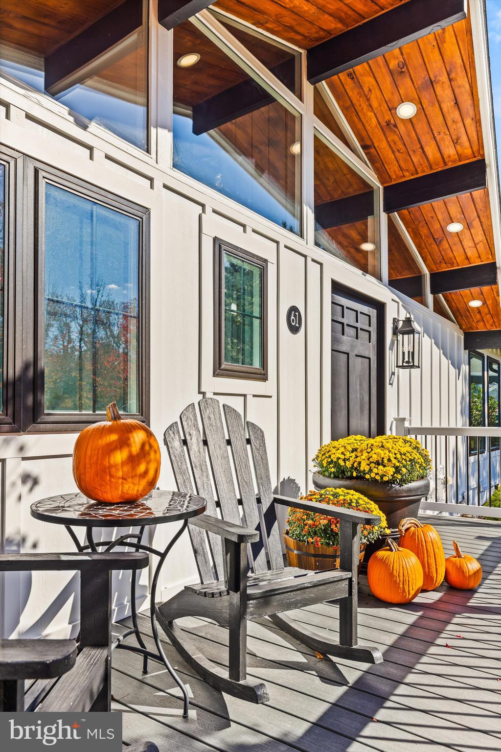 61 Grand Port Road Ocean Pines, MD 21811 - Photo 49 of 68 a view of a patio with table and chairs with wooden floor and fence