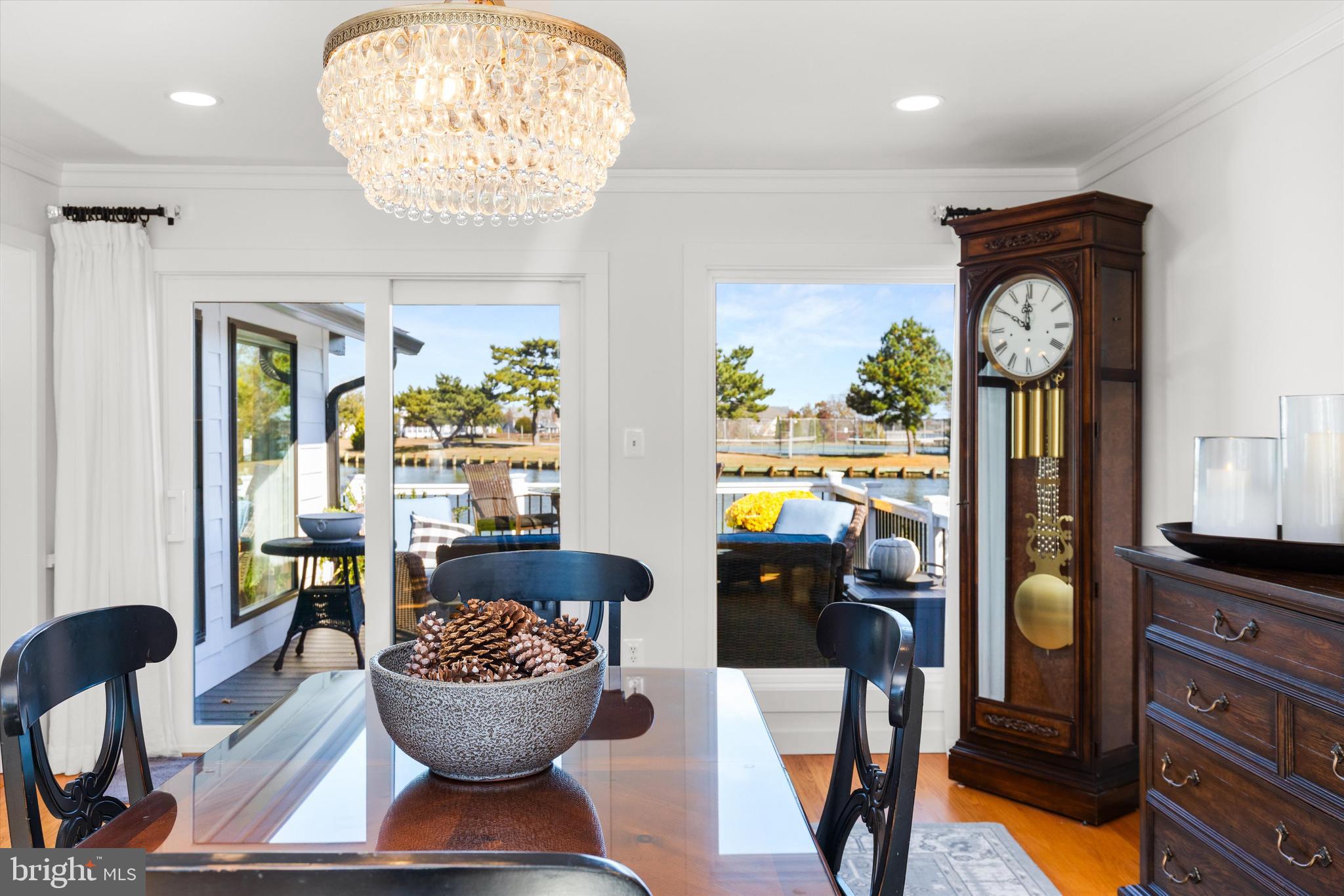 61 Grand Port Road Ocean Pines, MD 21811 - Photo 8 of 68 a view of a dining room with furniture and chandelier
