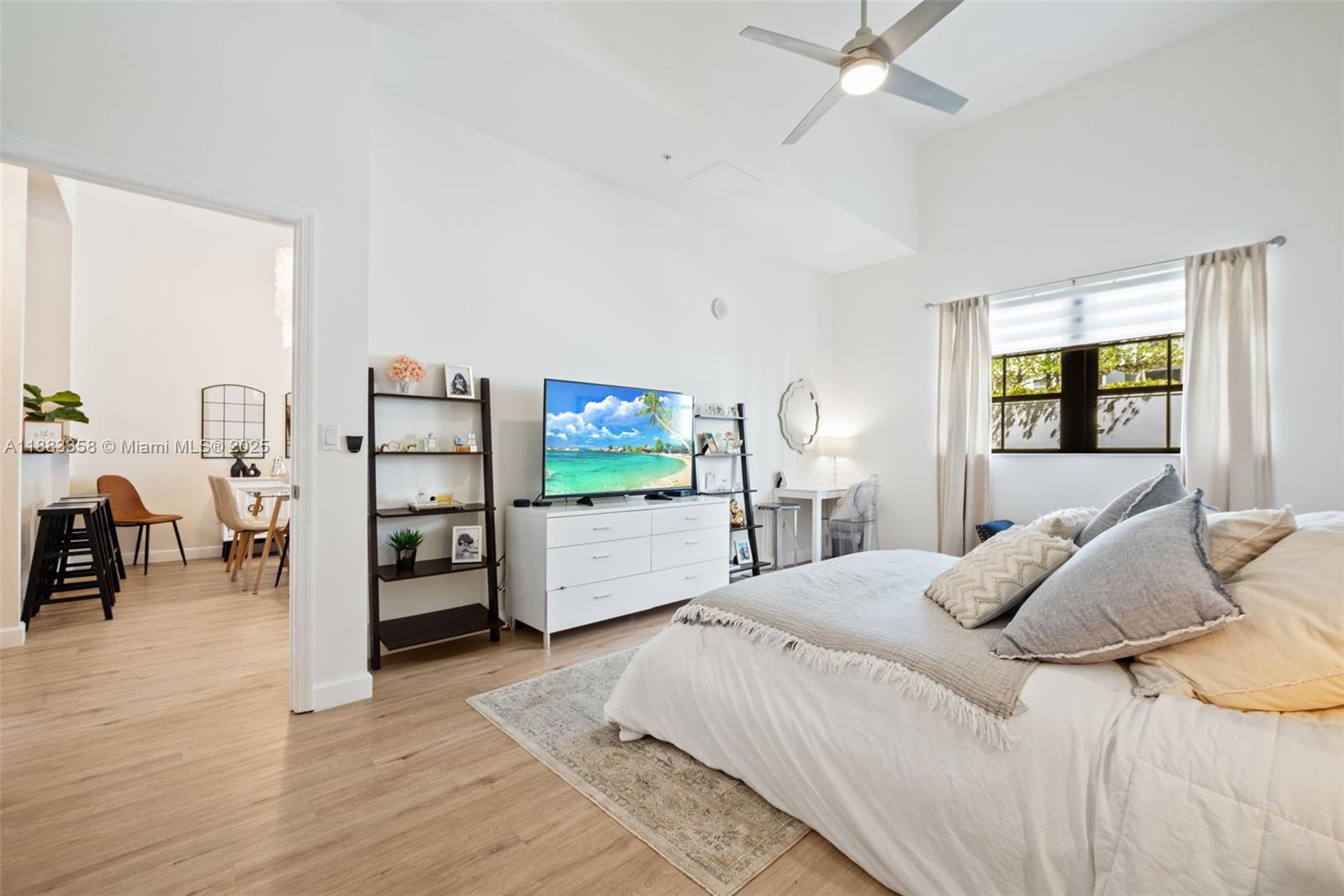 8390 Southwest 72nd Avenue, Unit 314 Miami, FL 33143 - Photo 11 of 35 a bedroom with furniture and a large window