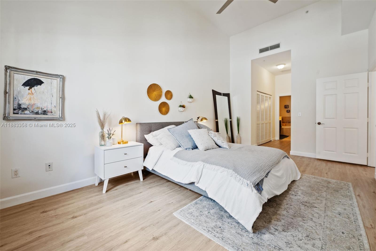 8390 Southwest 72nd Avenue, Unit 314 Miami, FL 33143 - Photo 12 of 35 a spacious bedroom with a bed and a table