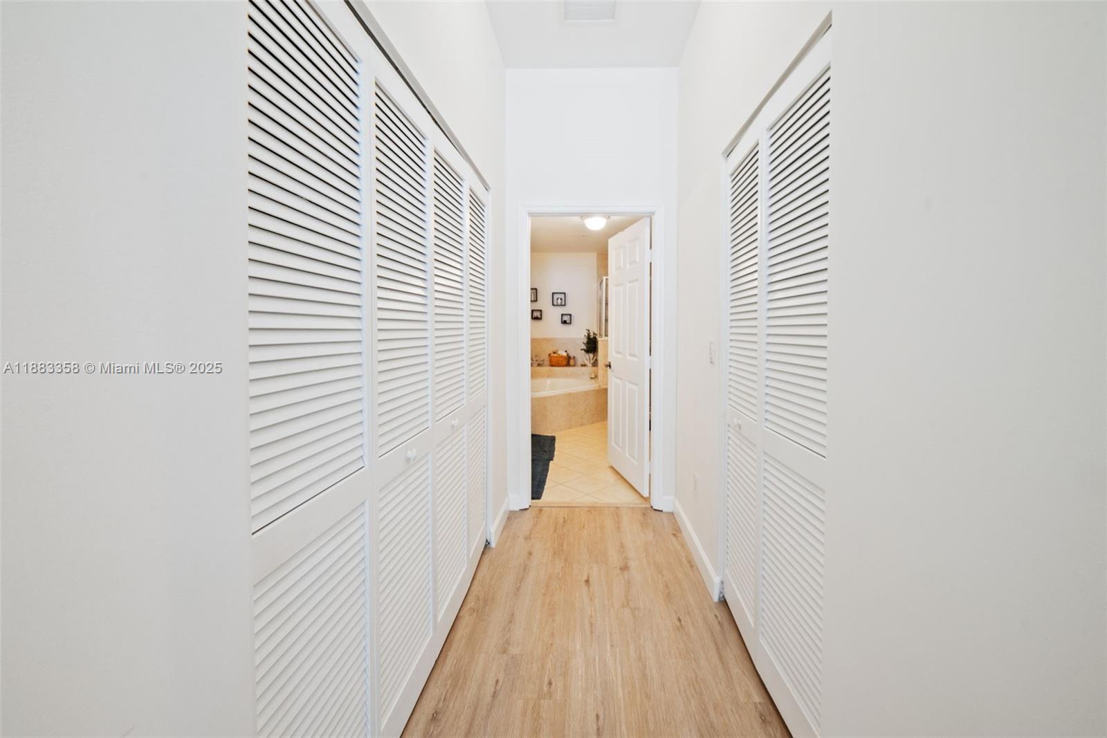 8390 Southwest 72nd Avenue, Unit 314 Miami, FL 33143 - Photo 14 of 35 a view of a hallway with wooden floor and staircase
