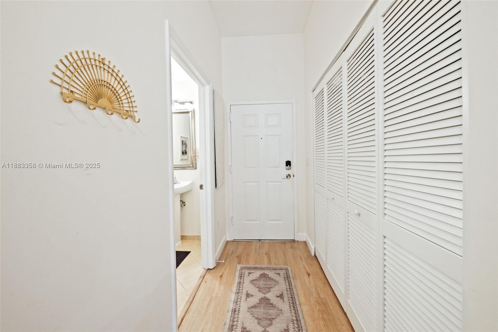 8390 Southwest 72nd Avenue, Unit 314 Miami, FL 33143 - Photo 17 of 35 a view of a hallway with wooden floor and staircase