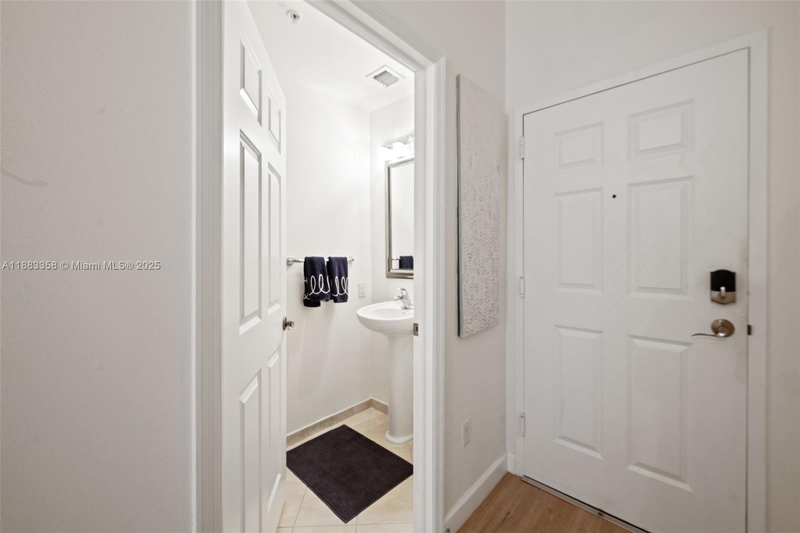 8390 Southwest 72nd Avenue, Unit 314 Miami, FL 33143 - Photo 18 of 35 a view of a bathroom from a hallway