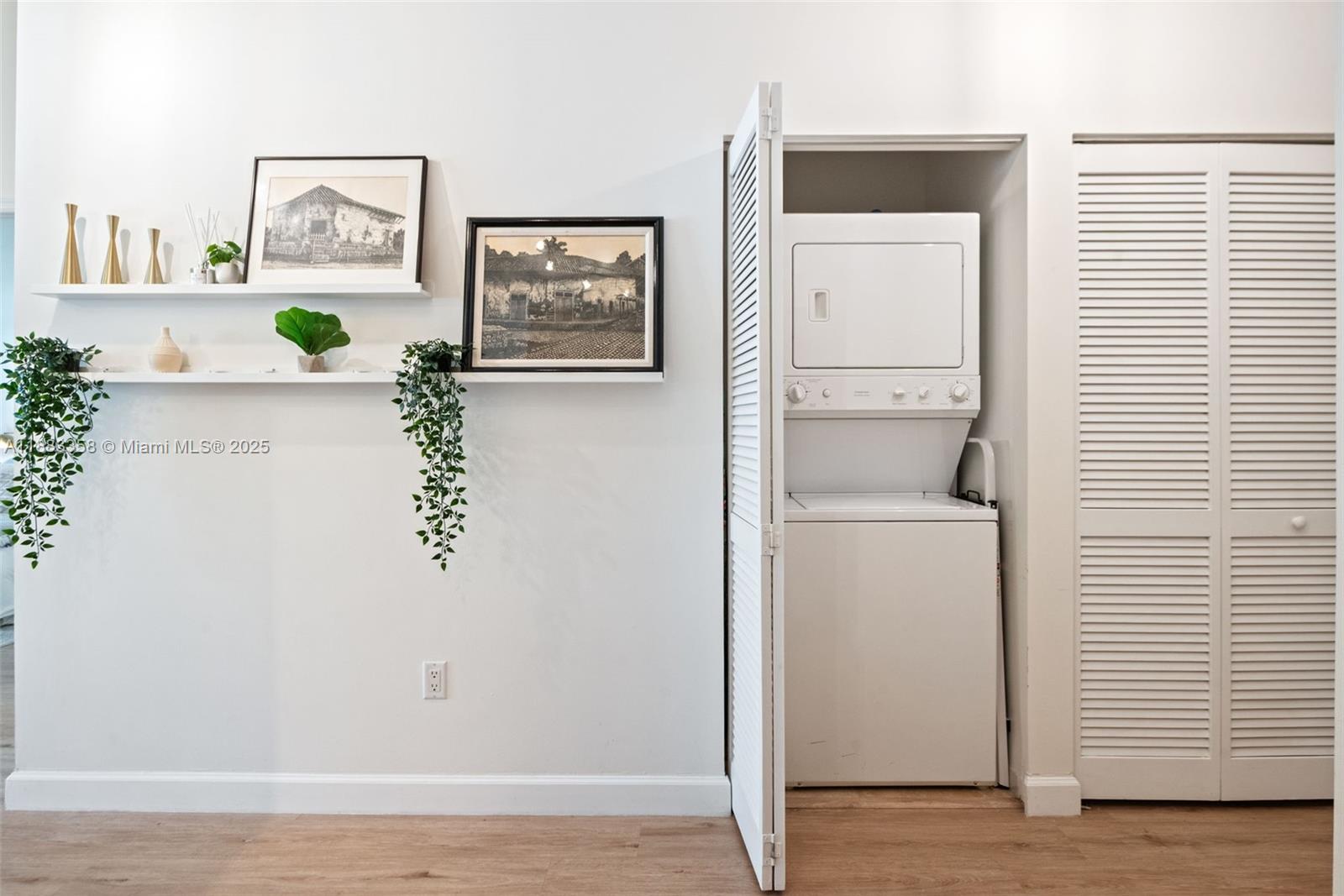 8390 Southwest 72nd Avenue, Unit 314 Miami, FL 33143 - Photo 20 of 35 a view of a hallway with paintings on the wall