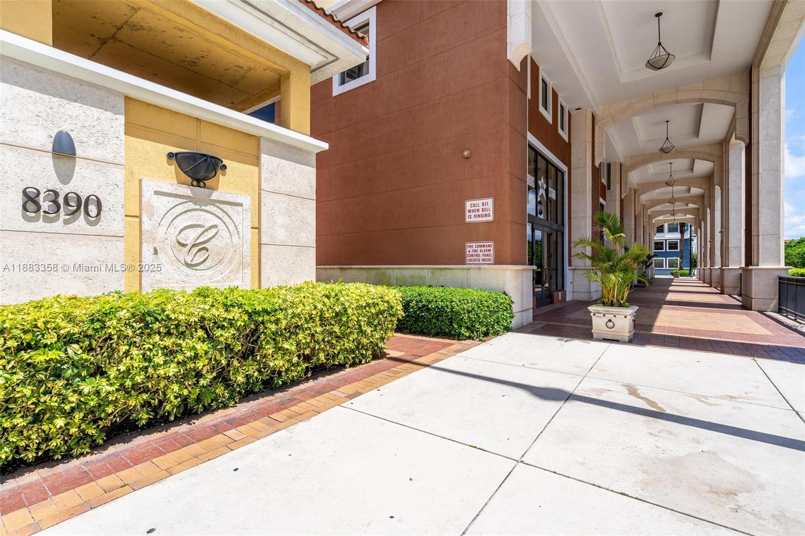 8390 Southwest 72nd Avenue, Unit 314 Miami, FL 33143 - Photo 27 of 35 a view of a building with potted plants