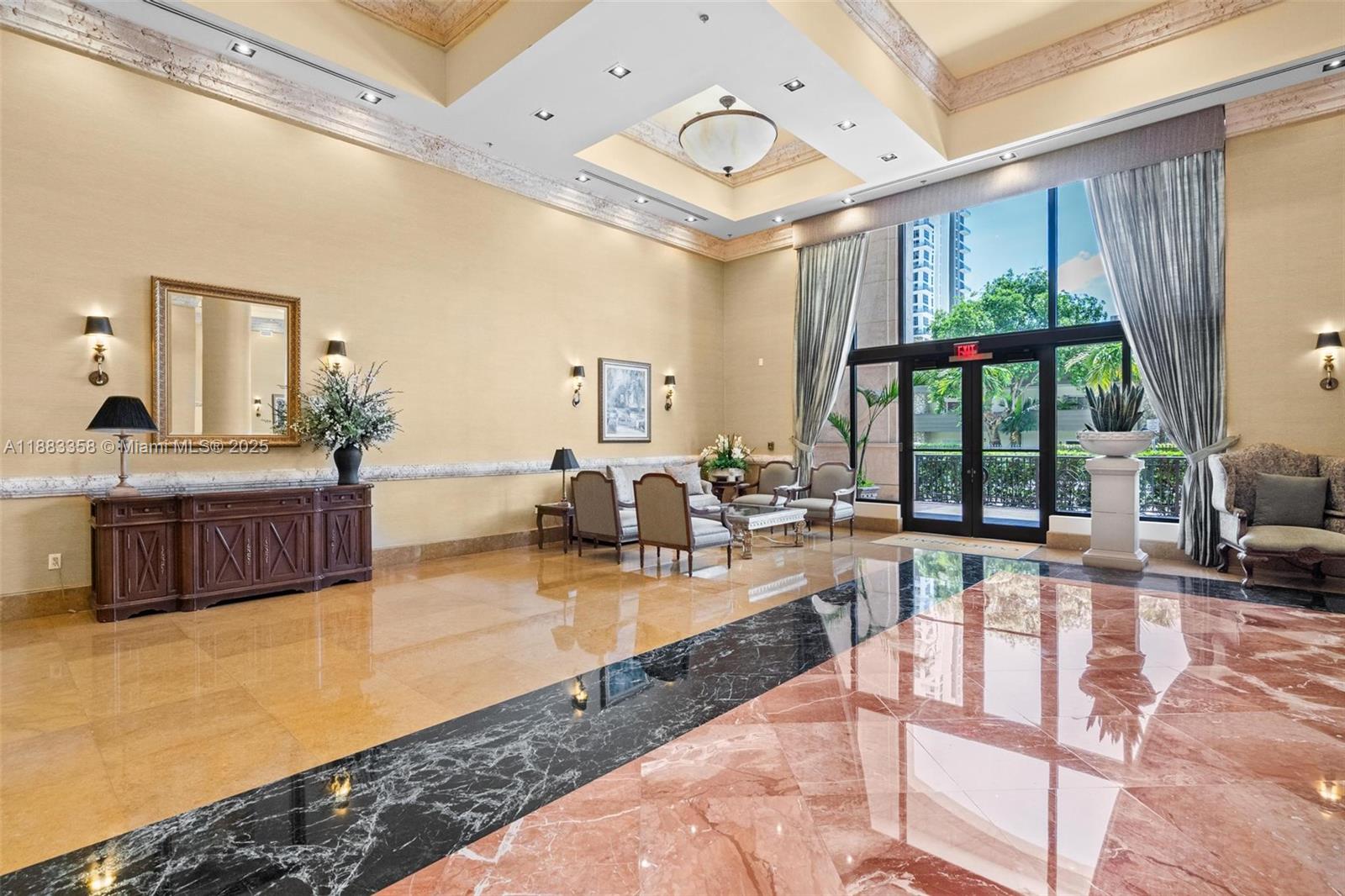 8390 Southwest 72nd Avenue, Unit 314 Miami, FL 33143 - Photo 28 of 35 a living room with furniture large windows and wooden floor
