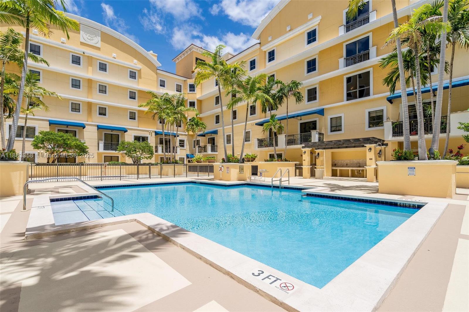 8390 Southwest 72nd Avenue, Unit 314 Miami, FL 33143 - Photo 29 of 35 a view of building with swimming pool