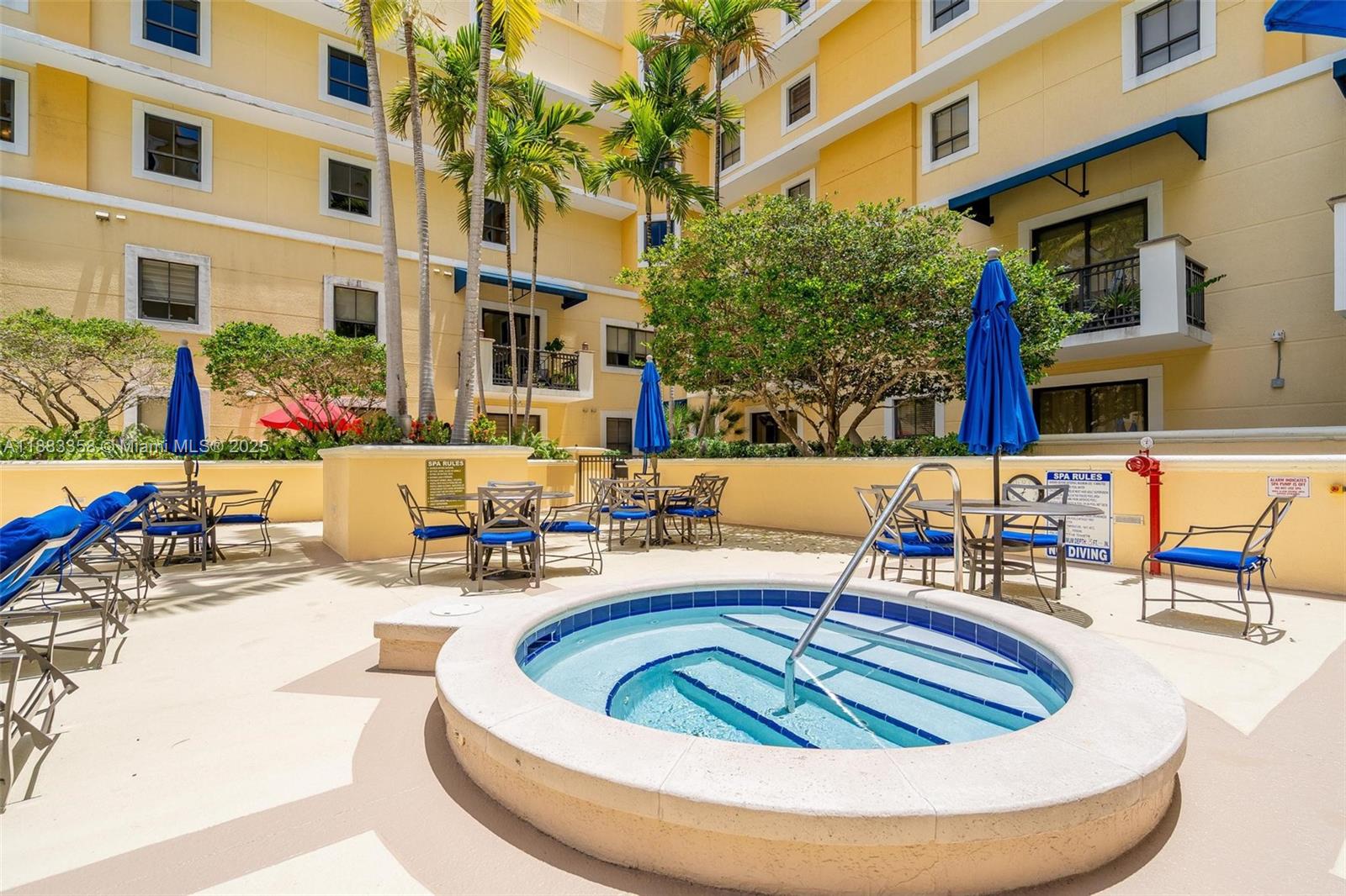 8390 Southwest 72nd Avenue, Unit 314 Miami, FL 33143 - Photo 30 of 35 a view of a swimming pool with outdoor seating
