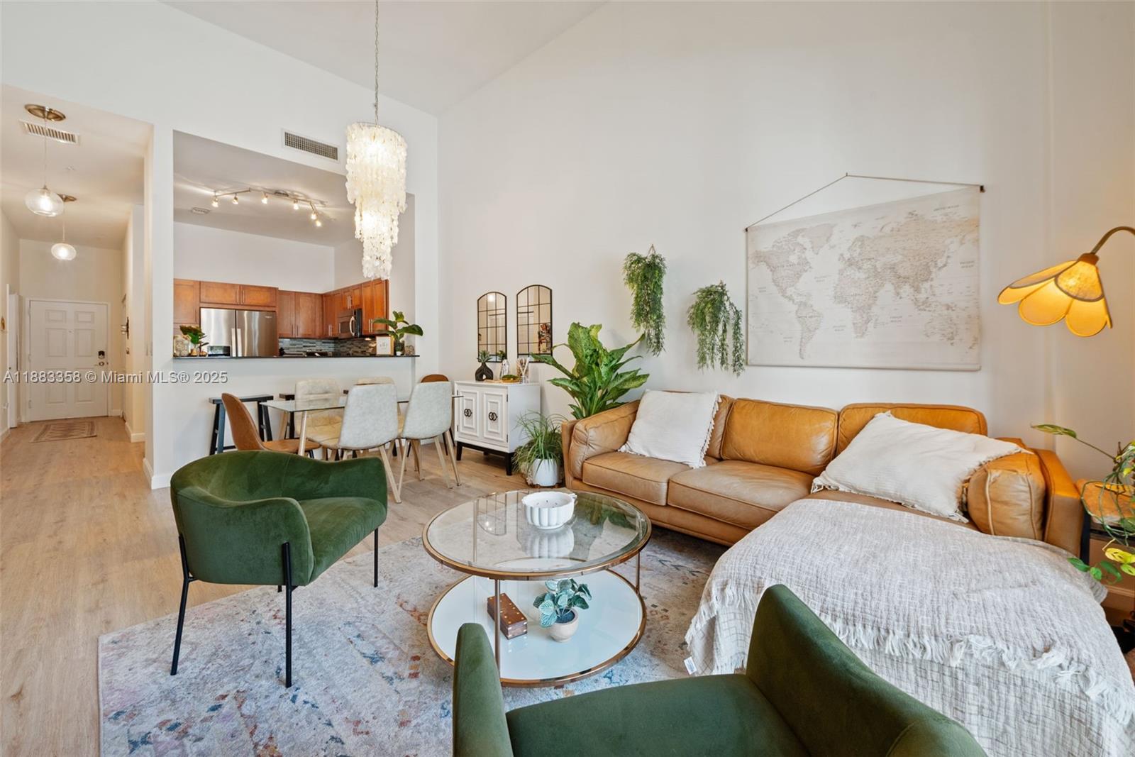 8390 Southwest 72nd Avenue, Unit 314 Miami, FL 33143 - Photo 3 of 35 a living room with furniture and a lamp