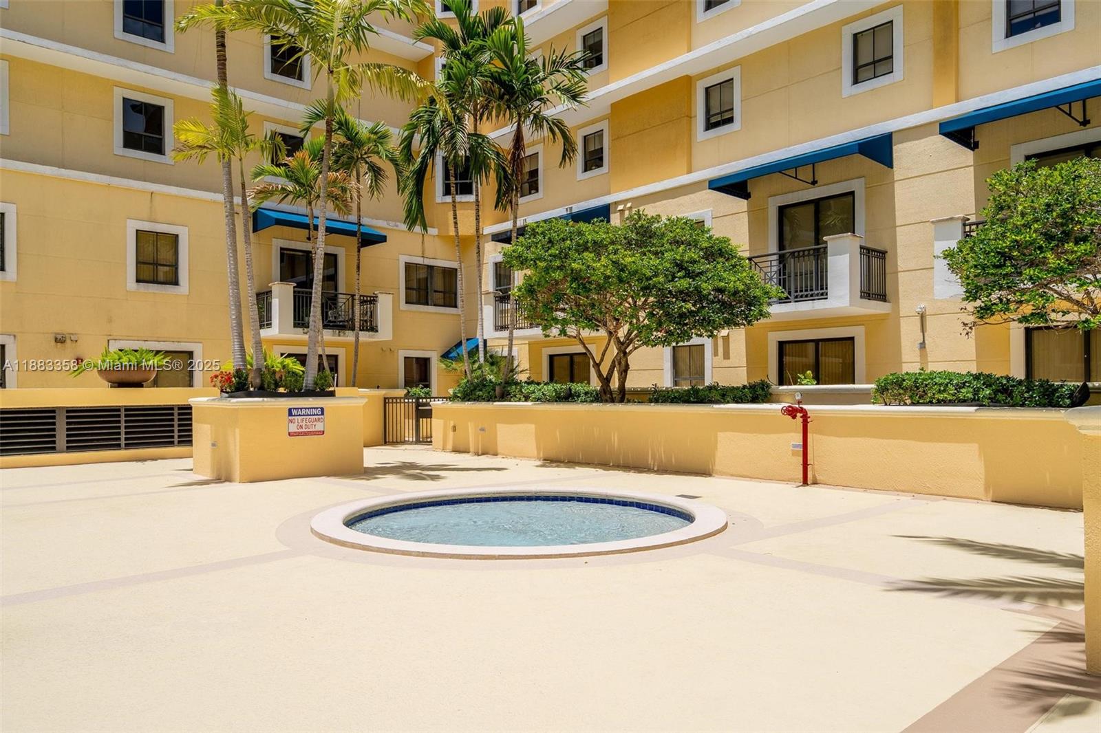 8390 Southwest 72nd Avenue, Unit 314 Miami, FL 33143 - Photo 31 of 35 a view of a building with a swimming pool