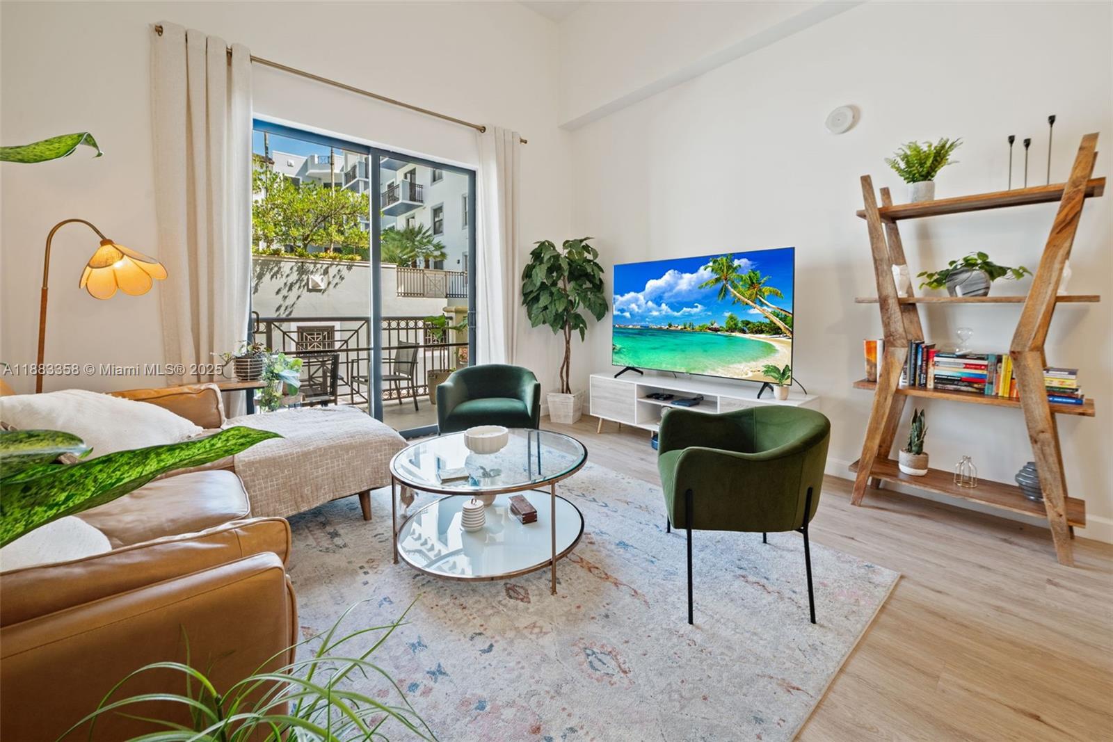8390 Southwest 72nd Avenue, Unit 314 Miami, FL 33143 - Photo 4 of 35 a living room with furniture and a flat screen tv