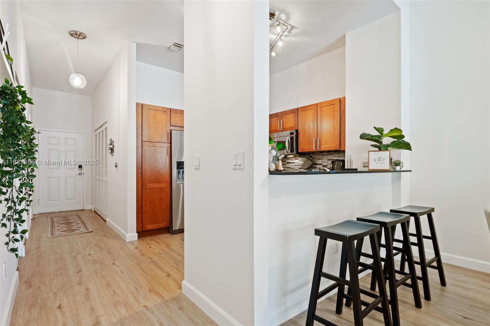 8390 Southwest 72nd Avenue, Unit 314 Miami, FL 33143 - Photo 9 of 35 a view of a dining room with furniture and wooden floor