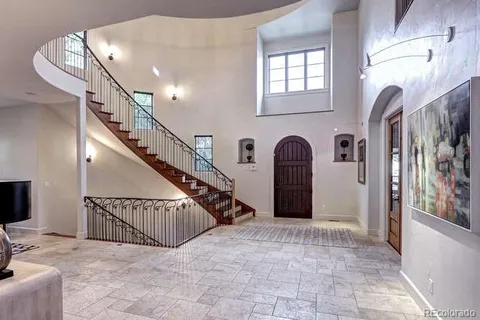 a view of entryway and hall with a front door
