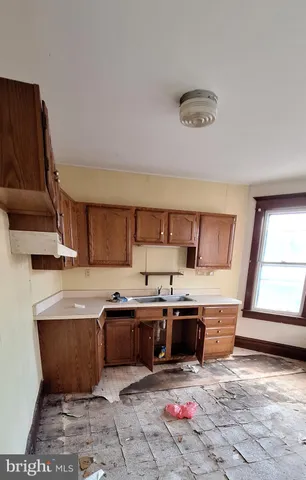 a kitchen with stainless steel appliances granite countertop a sink dishwasher stove and cabinets