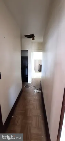 a view of empty room with a fireplace