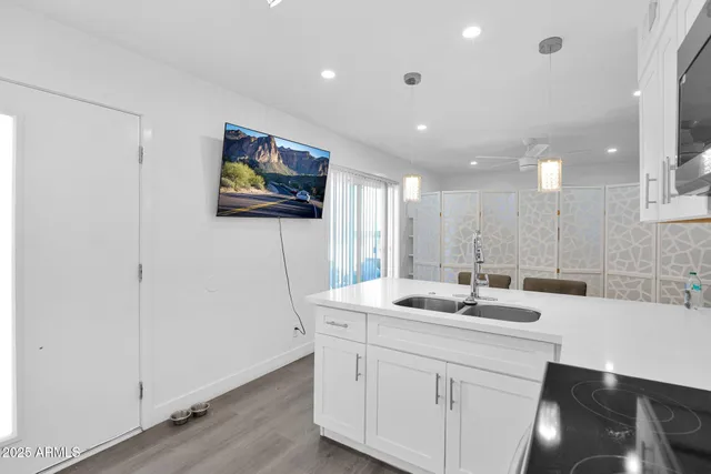 a bathroom with a sink a mirror and a shower