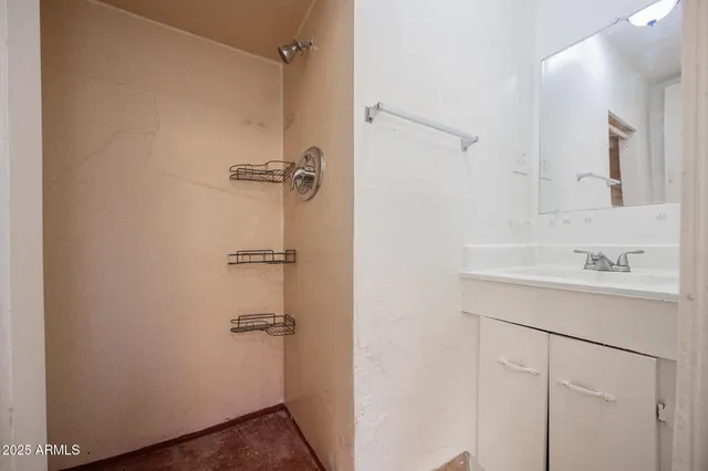 a bathroom with a shower sink