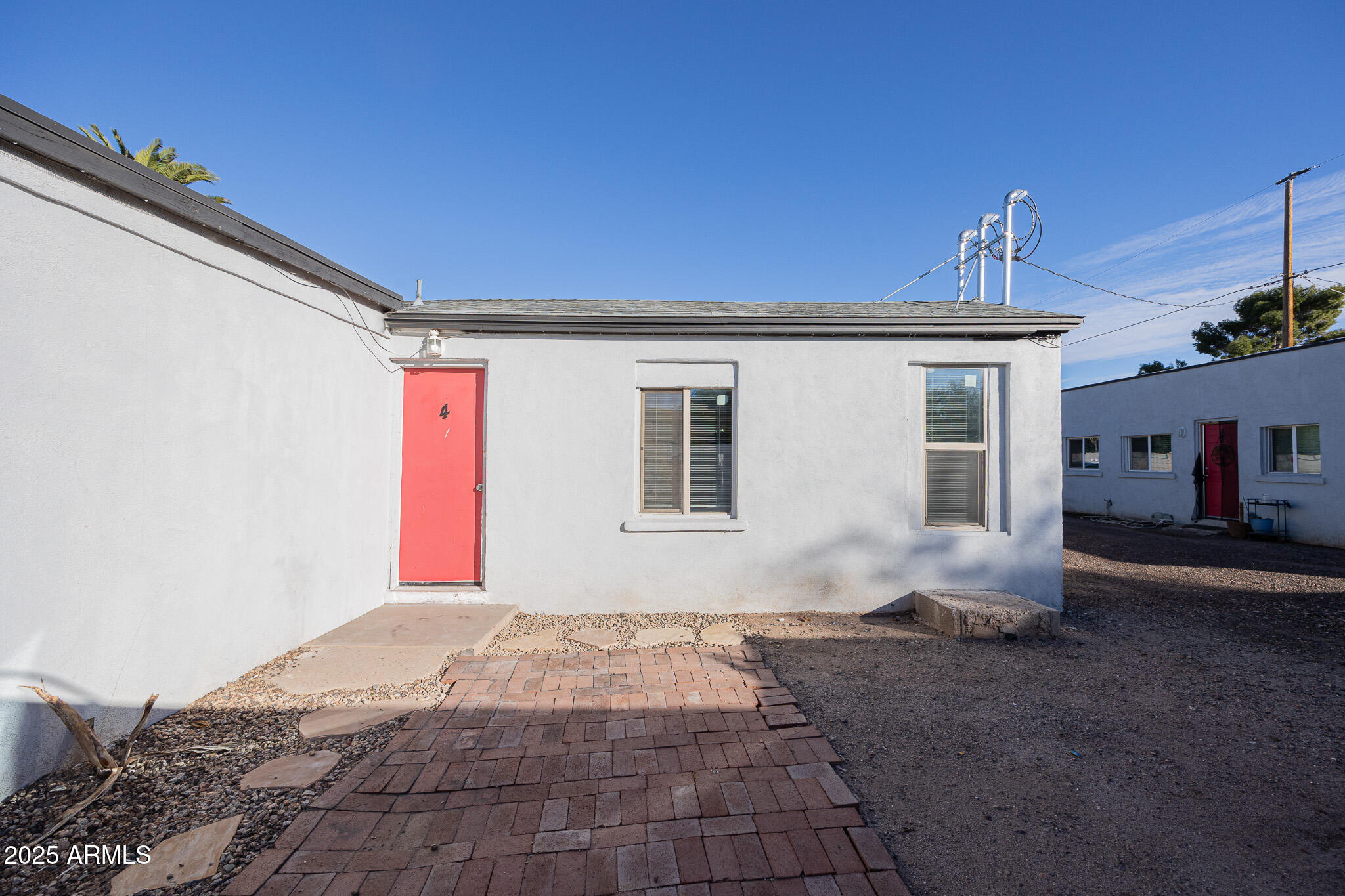 2537 East Willetta Street, Unit 4 Phoenix, AZ 85008 - Photo 2 of 15 a front view of a house with yard