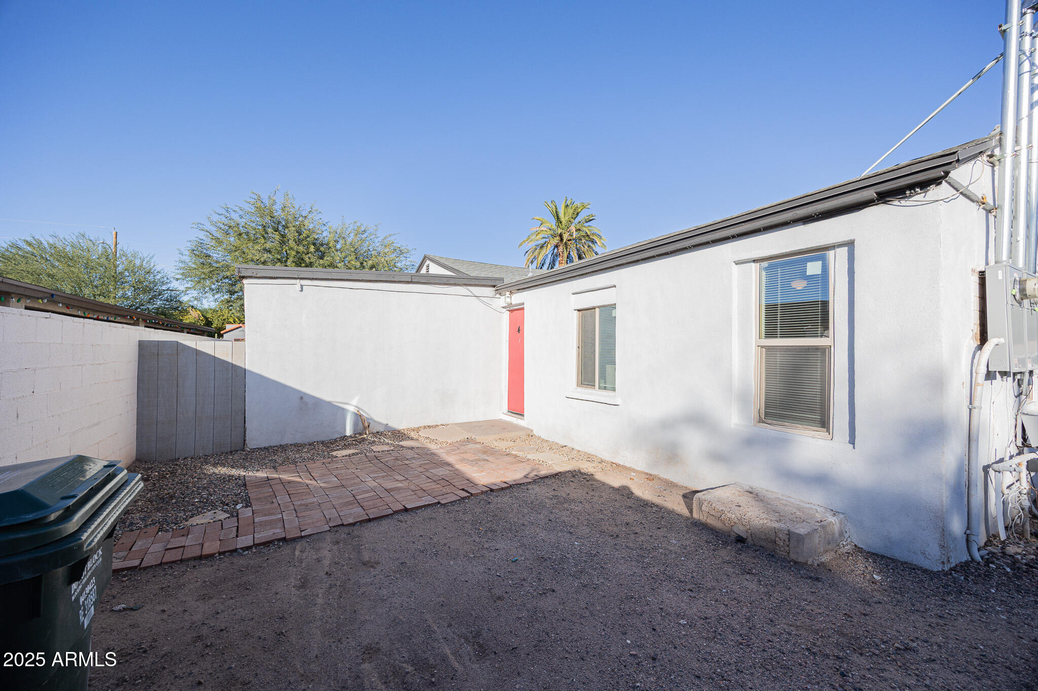 2537 East Willetta Street, Unit 4 Phoenix, AZ 85008 - Photo 3 of 15 a front view of a house with a yard