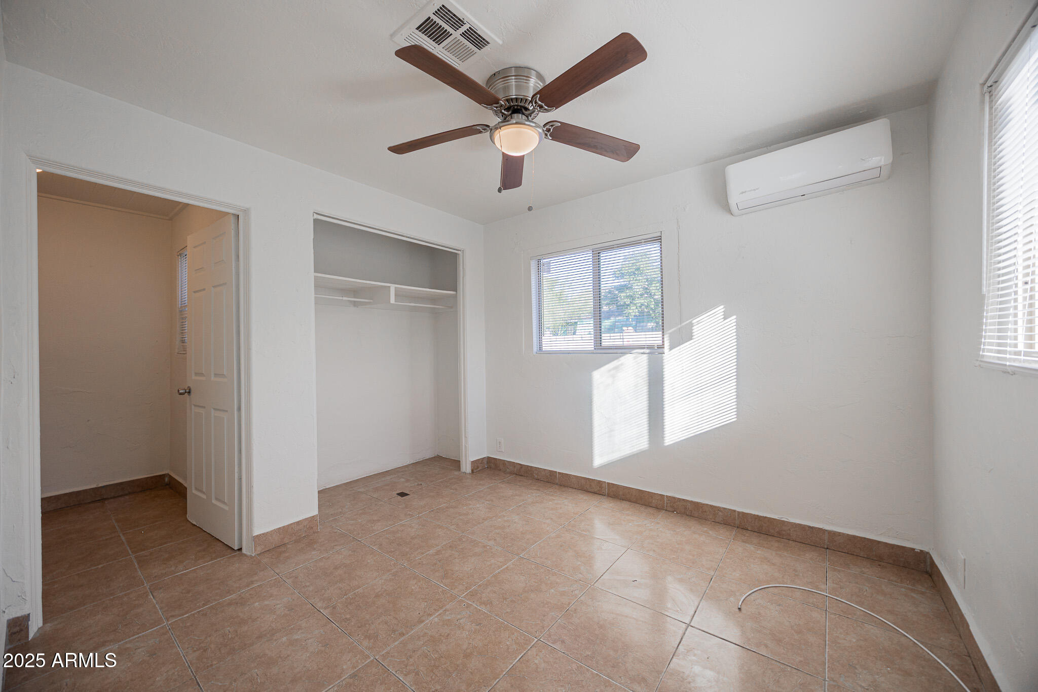 2537 East Willetta Street, Unit 4 Phoenix, AZ 85008 - Photo 7 of 15 a view of an empty room with a window