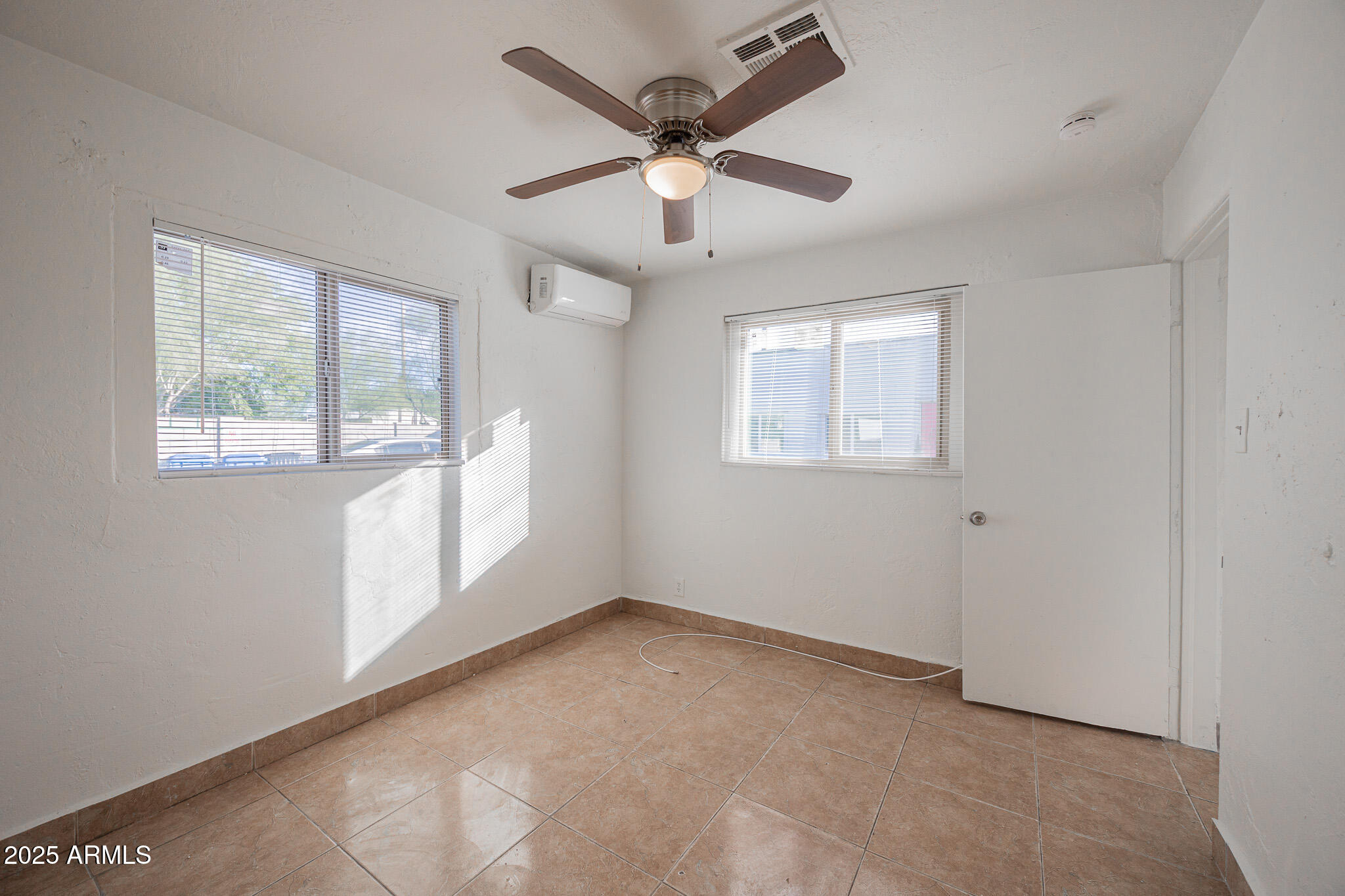 2537 East Willetta Street, Unit 4 Phoenix, AZ 85008 - Photo 10 of 15 a view of an empty room with a window
