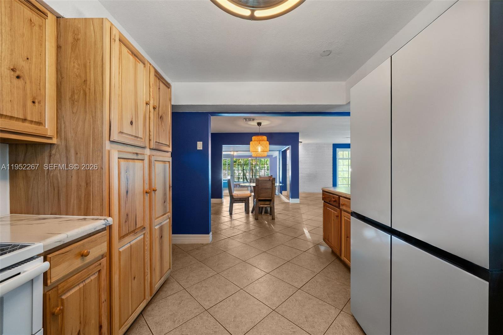 5741 Southwest 14th Street Plantation, FL 33317 - Photo 12 of 29 a kitchen with stainless steel appliances granite countertop a refrigerator and a sink
