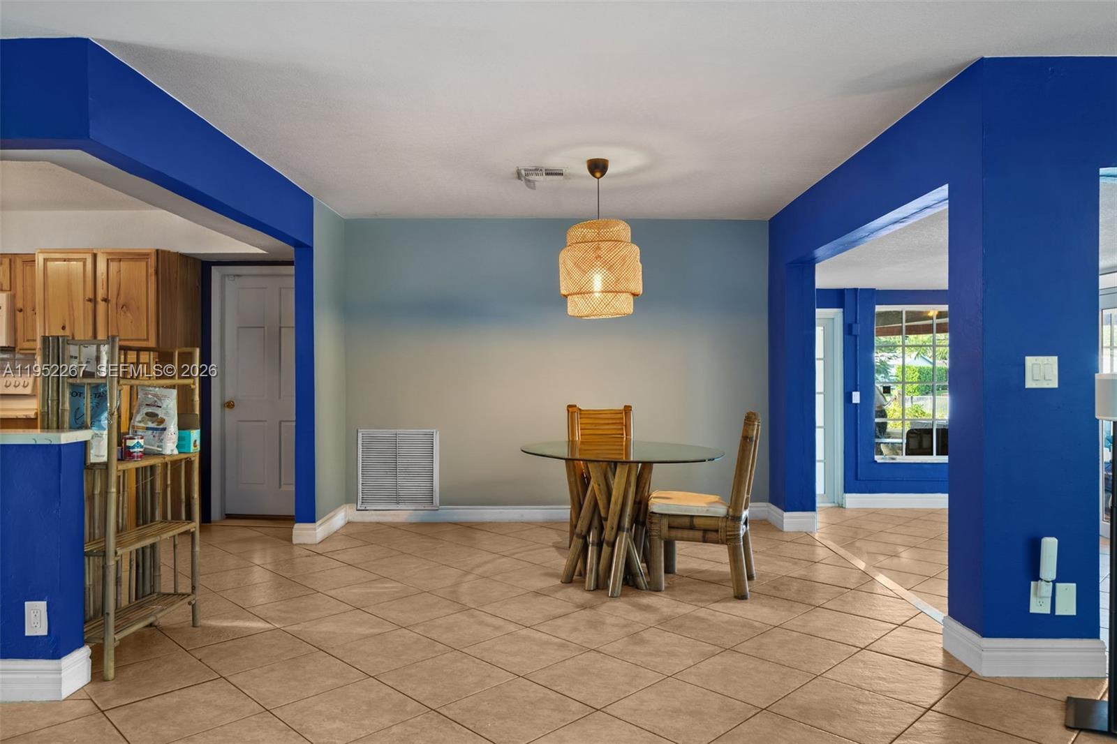 5741 Southwest 14th Street Plantation, FL 33317 - Photo 13 of 29 a view of a dining room with furniture and chandelier