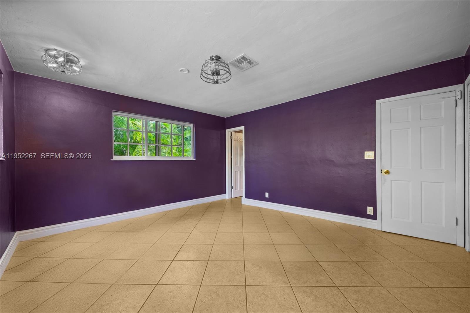 5741 Southwest 14th Street Plantation, FL 33317 - Photo 21 of 29 a view of an empty room with a window
