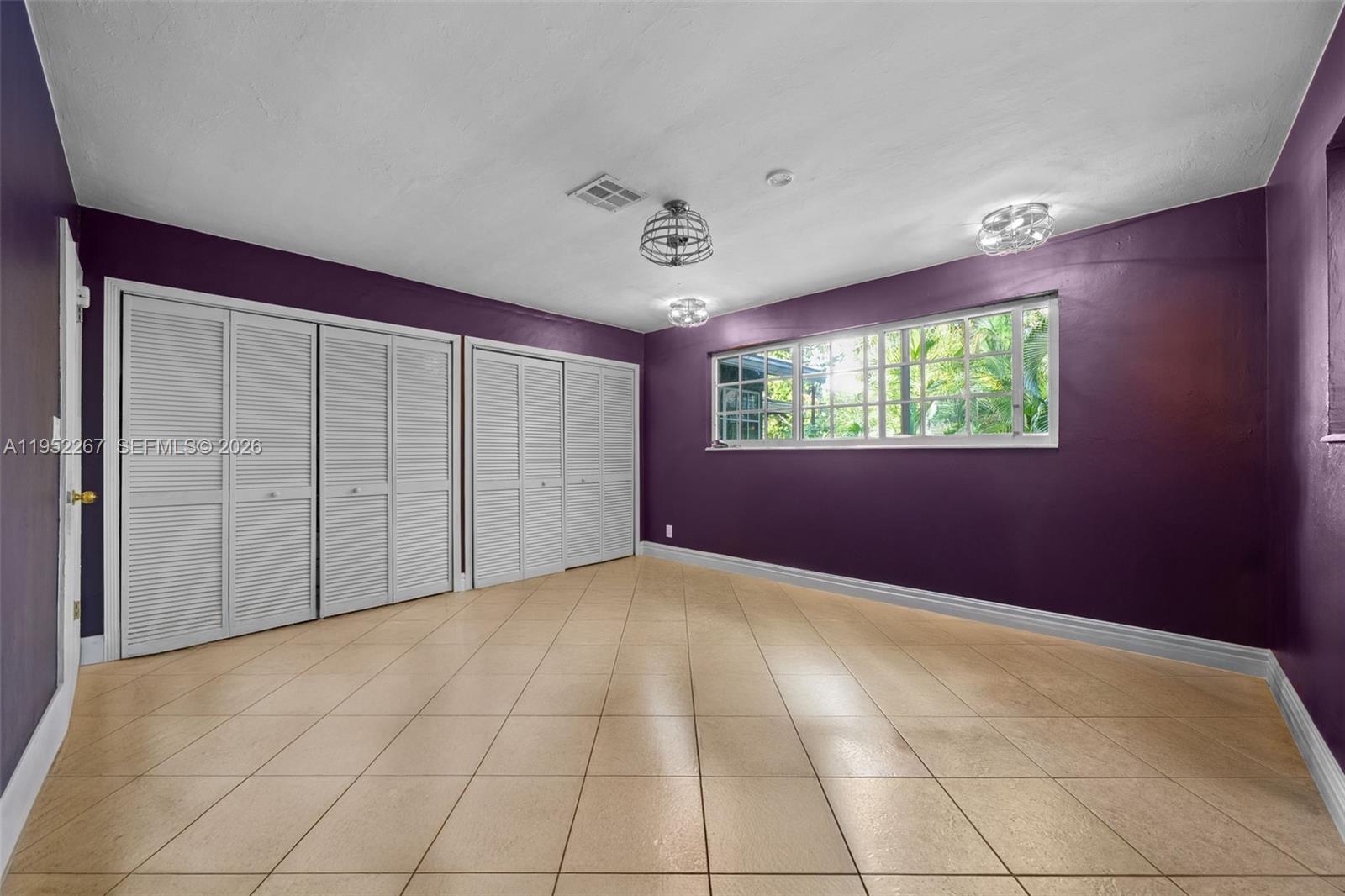 5741 Southwest 14th Street Plantation, FL 33317 - Photo 22 of 29 a view of an empty room with windows