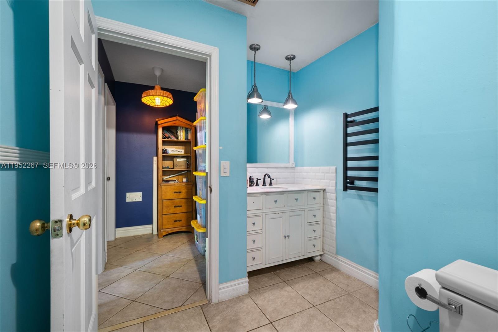 5741 Southwest 14th Street Plantation, FL 33317 - Photo 24 of 29 a bathroom with a sink and a mirror
