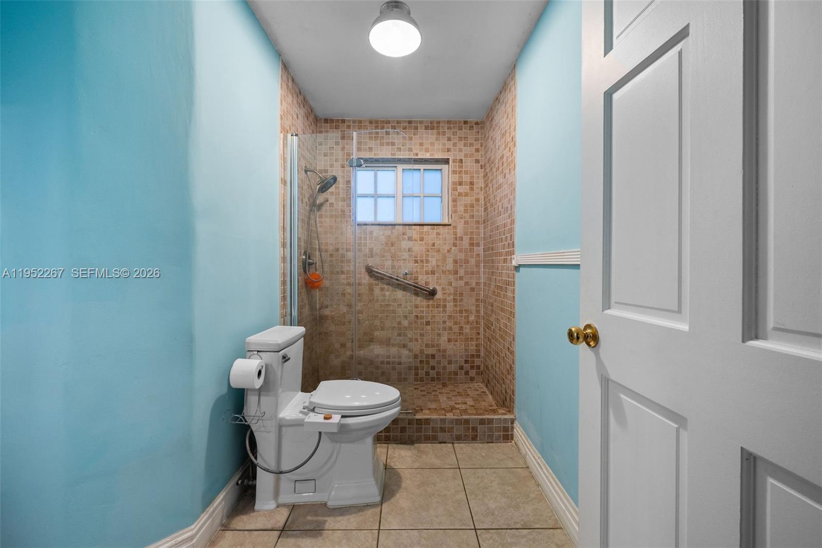 5741 Southwest 14th Street Plantation, FL 33317 - Photo 25 of 29 a bathroom with a toilet and a shower