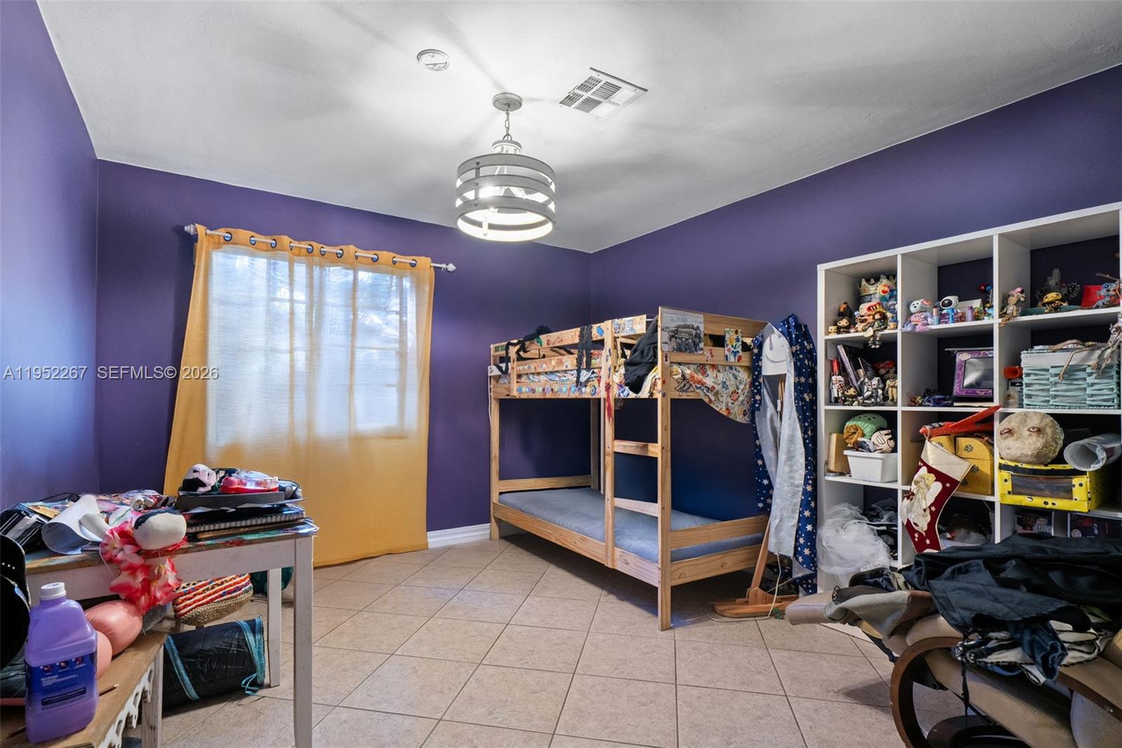 5741 Southwest 14th Street Plantation, FL 33317 - Photo 26 of 29 a bedroom with furniture and a chandelier