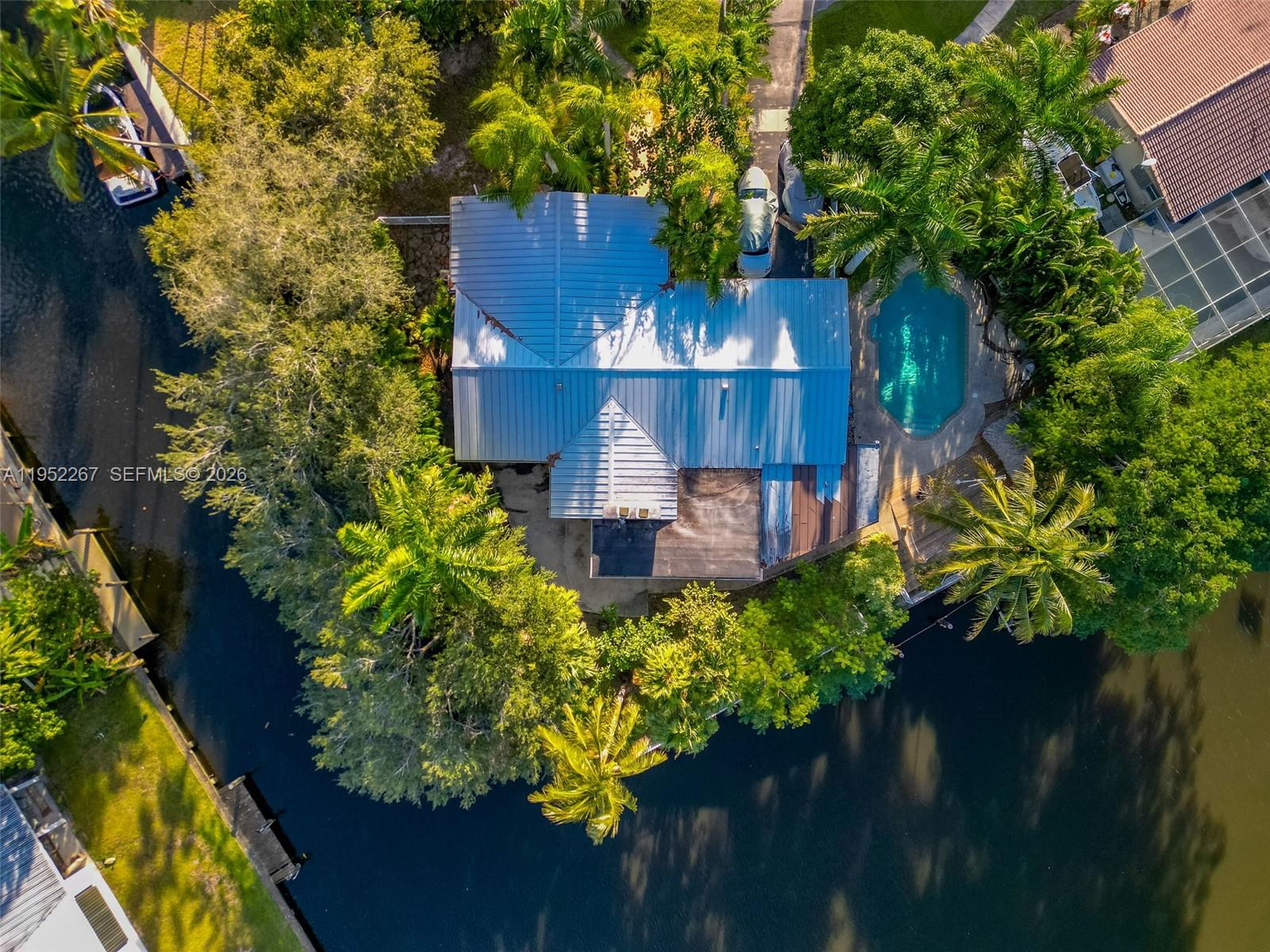 5741 Southwest 14th Street Plantation, FL 33317 - Photo 3 of 29 front view of a house with a yard