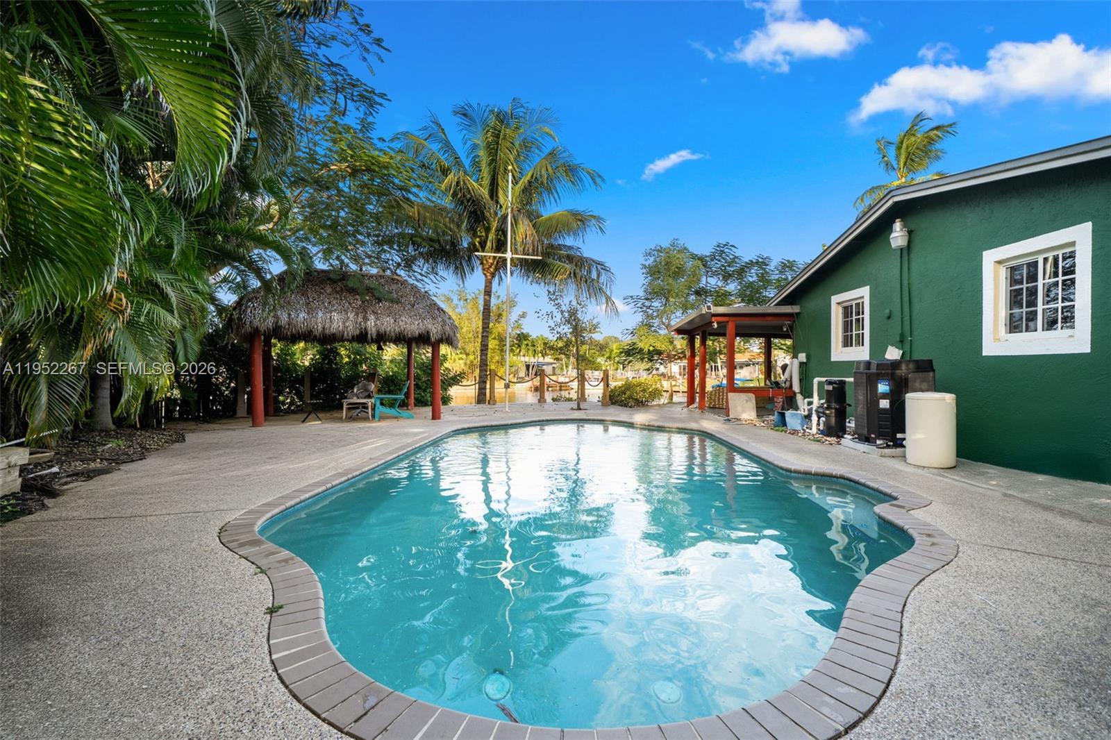 5741 Southwest 14th Street Plantation, FL 33317 - Photo 8 of 29 a view of a swimming pool with a patio