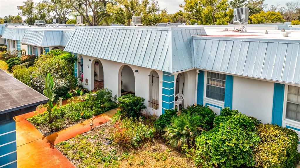 4231 Tamargo Drive, Unit 3 New Port Richey, FL 34652 - Photo 47 of 47 a view of a house with a yard and plants