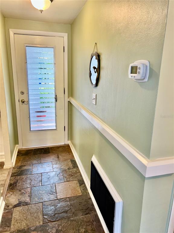 4231 Tamargo Drive, Unit 3 New Port Richey, FL 34652 - Photo 9 of 47 a view of room with window and stairs